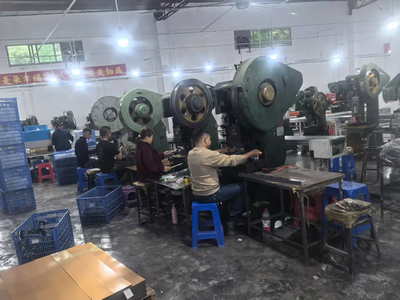 Baoyue operators working with pressing equipment
