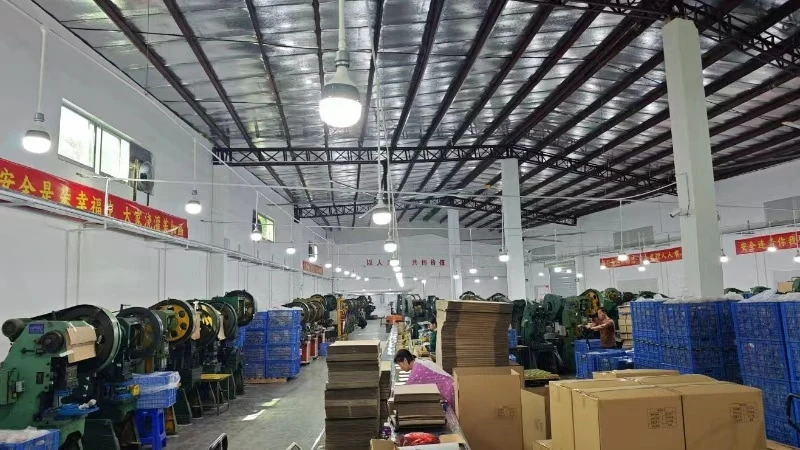 Production workshop with tin forming machines and packing cartons at Baoyue