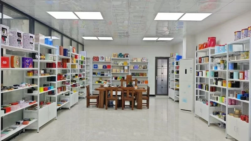 Baoyue sample room with shelves of tin packaging references